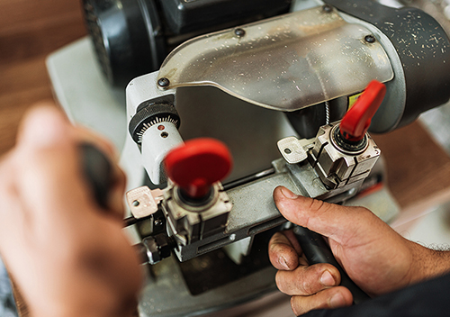 photo of a key getting cut